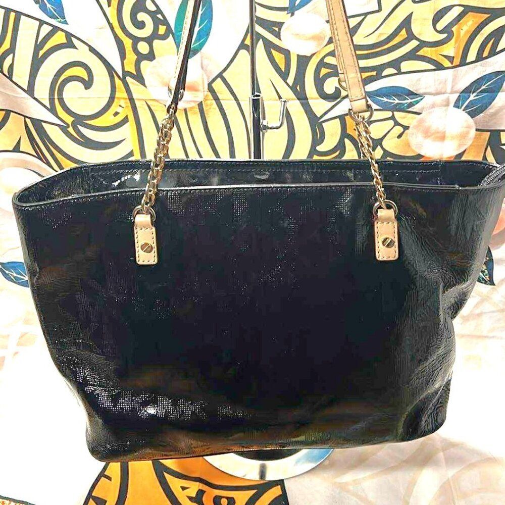 Michael Kors Jet Set Chain Tote in black patent leather with gold hardware.
